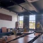 Leamon Fresh Cleaning A restaurant interior featuring neatly arranged tables and chairs in the center of the room.
